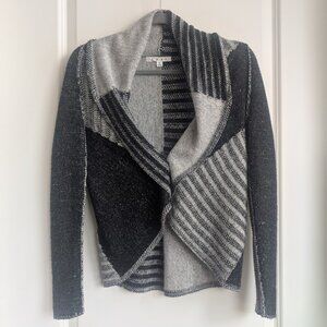 Cabi.  cozy shrug/cardigan sweater in patchwork style knit.
